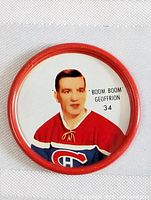 Close-up photo of one 1962 sheriff coin with image of 'Boom Boom' Geoffrion in Montreal Canadiens red jersey