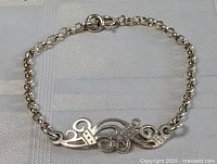 Bracelet fully displayed showing chain and unique centerpiece design.