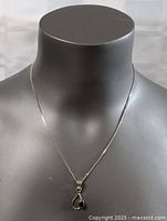 Necklace on display bust showing pendant and chain length