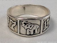 Oblique view showing relief panels with number 7, elephant and number 13