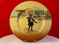 Full view of the Royal Doulton Dickens series plate showing the painted scene and overall plate condition.