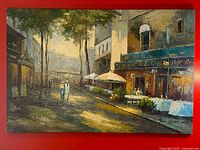 Full view of impressionistic street café scene on red background