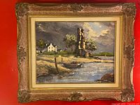Full view of framed landscape painting against red background