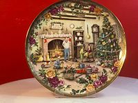 Front view of Royal Albert collection plate showing detailed Christmas family scene and floral border.