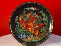Plate front showing detailed Russian scene with castle, horseman, and ornamental gold border.