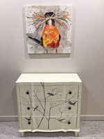 Full view showing dresser and mounted bird painting