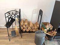Full set showing fireplace tools on stand, log rack with firewood, bucket with kindling, and box of fire-start materials.