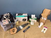 Overview of all items showing electric pump box, tools, timers, light bulbs, and extension cords.