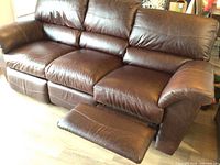 Full view of sofa with left recliner extended