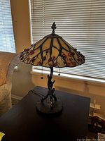 Front view of one lamp showing full dome shade and base