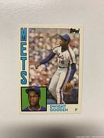 Front of the 1984 Topps Traded Dwight Gooden rookie card showing Gooden in Mets uniform with team name and player info.