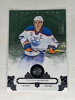 Front of 2017-18 Upper Deck Artifacts Connor McDavid hockey card serial numbered 448/599