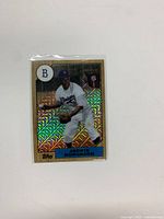 Front of 2017 Topps Chrome Silver Pack baseball card featuring Jackie Robinson in Brooklyn Dodgers uniform with holographic background.