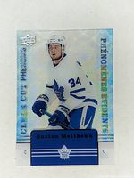 Front photo of the 2019-20 Upper Deck Tim Hortons Clear Cut Phenom hockey card CC-15 featuring Auston Matthews in white Toronto Maple Leafs uniform with holographic finish.