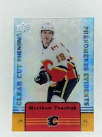Front of 2019-20 Upper Deck Tim Hortons Clear Cut Phenom CC-14 Matthew Tkachuk hockey card in Calgary Flames uniform.