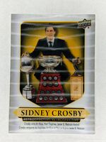 Front view of the Sidney Crosby Retrospective hockey card showing Crosby with his trophies and golden accents