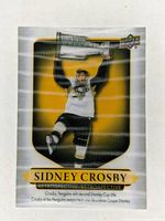 Front side of Sidney Crosby retrospective hockey card SC-7 showing him holding the Stanley Cup with Pittsburgh Penguins uniform.