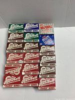 Multiple partial boxed sets of Topps, Fleer, and Score baseball trading cards from late 1980s to early 1990s. Boxes show various 'Traded' and 'Update' series with distinct colors and designs.