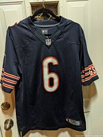 Front view of navy blue Chicago Bears NFL jersey with number 6 and NFL shield on collar.
