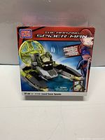 Front view of sealed MEGA BLOKS box showing set number 91338, The Amazing Spider Man themed Lizard Sewer Speeder with 91 pieces.