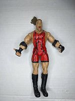 Front view of the Rob Van Dam wrestling action figure, showing red singlet and facial expression.