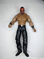 Front view of The Boogeyman wrestling figurine showing detailed face paint, muscular build, and black pants.