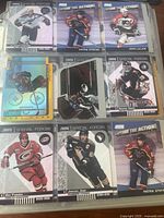 Photo showing a page of hockey cards with players such as Patrik Stefan, John LeClair, Ron Francis, Ed Belfour in Special Forces and Capture the Action series from 2000-2001.