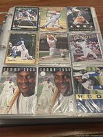 Page in binder showing cards including Mike Piazza Pinnacle, Sammy Sosa, and others