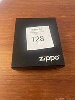 Black box with Zippo logo on it containing the kit items