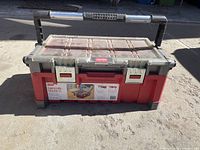 Closed red and gray 22 inch cantilever toolbox with metal latches and carry handle, labeled Husky.