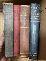 Four early 1900s hardcover books showing front spines.