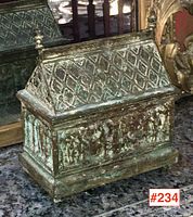 Front and side view showing embossed relief panels and roof pattern