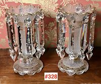 Two matching French glass lustres with scalloped rims, etched and gilded decoration, hanging crystal prisms