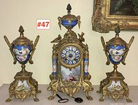 Full set view showing clock centered between two garnitures