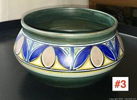 Side angled view of the Gouda pottery bowl showing decorative patterns and shape.