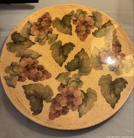 Top view showing grape clusters and leaves painted on the lazy Susan surface