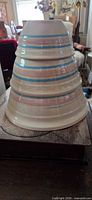 Three stacked bowls showing exterior stripes and nesting sizes