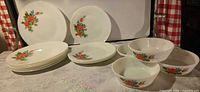 Full set showing stacked plates, upright plates and four bowls