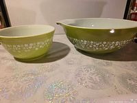 Both Pyrex Spring Blossom bowls side by side showing exterior pattern and size difference