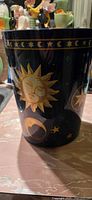 Front view showing sun graphic and rim border