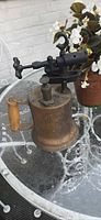 Full view of blowtorch right side showing wood handle and burner assembly