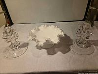Overall view showing compote flanked by two candlesticks