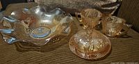 All four pieces: ruffled bowl, covered dish, creamer, sugar bowl