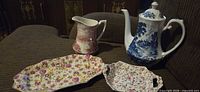 Group shot of coffee pot, pitcher, oblong chintz platter, square chintz dish
