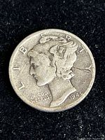First 1945 Winged Liberty Head Mercury dime showing Lady Liberty profile with winged cap, visible inscriptions and date 1945.