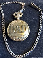 Photo of silver-tone pocket watch with 