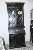 Front view of distressed brown secretary desk with hutch