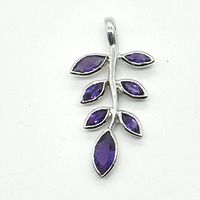 Front view of silver amethyst pendant shaped like a branch with seven marquise-cut stones