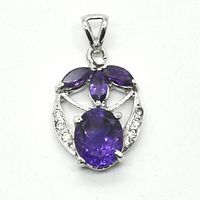 Front view of silver rhodium plated pendant with oval amethyst, three marquise amethysts, and small cubic zirconia stones.