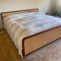 Front view of assembled king size platform bed frame with fabric cover